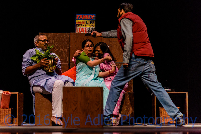 This may be my favorite image from the whole event.  I love the dramatic tension and the irony of the slogan on the sign above the terrified family.  The usual tips apply here: use a fast lens, a fast shutter speed, and a reasonable ISO setting; frame the shot in advance on the area where the action will occur; and shoot many images.  In post-processing, I cropped a bit for dramatic effect and lowered the black point so that the backdrop appears completely black for more contrast with the actors.  